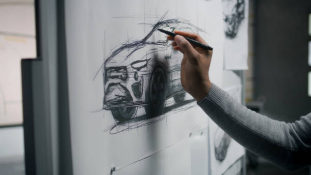 istock Designer drawing new car sketch with marker 1440351146