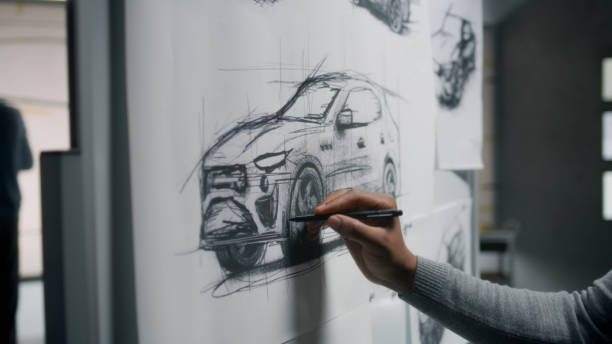 istock Designer drawing new car sketch with marker 1440351240