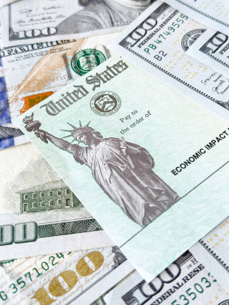 istock Stimulus check, 100 dollar bills and social Security Card 1440355241