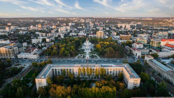 Aerial drone view of Chisinau downtown at sunset, Moldova Aerial drone view of Chisinau downtown at sunset, Moldova. View of Central Park, Cathedral, Goverment and a lot of greenery, buildings, illumination moldova stock pictures, royalty-free photos & images