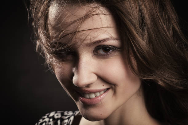 Portrait of smiling long haired girl. Horizontally.
