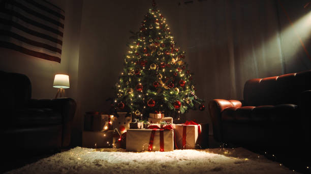 istock Christmas tree in a house with sofas and white carpet 1440358606
