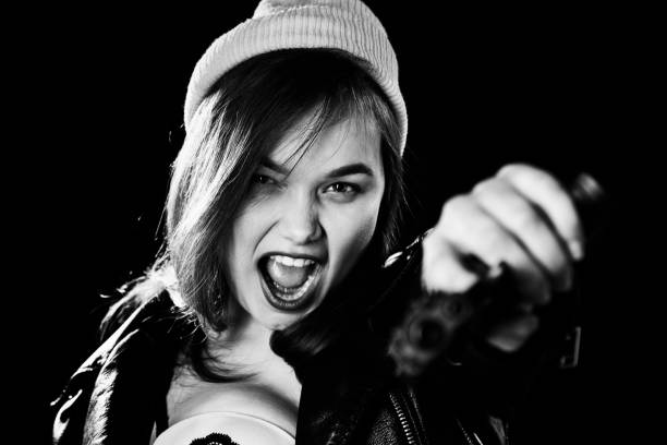 istock girl with gun 1440358688