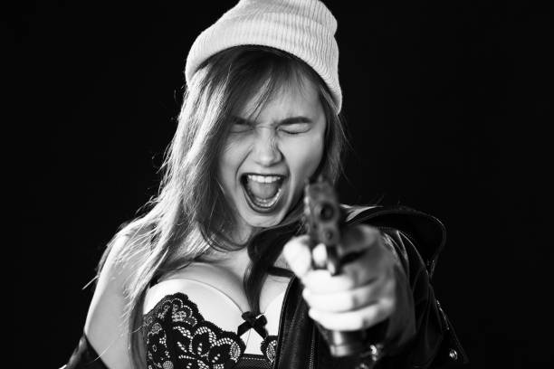 istock girl with gun 1440358924
