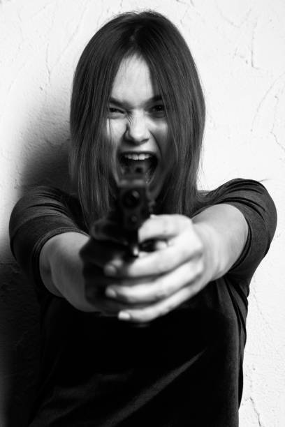 istock girl with gun 1440359320