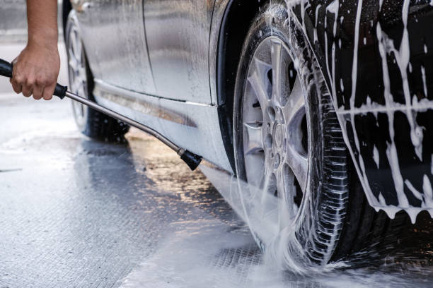 istock Car wash. Close-up car is in the active foam. 1440360301