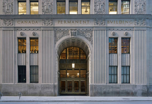 Toronto, Canada - November 9 2022:  Close-up view of the ornate stone decorations on a bank building in Toronto's financial district on Bay Street, constructed in 1932.
