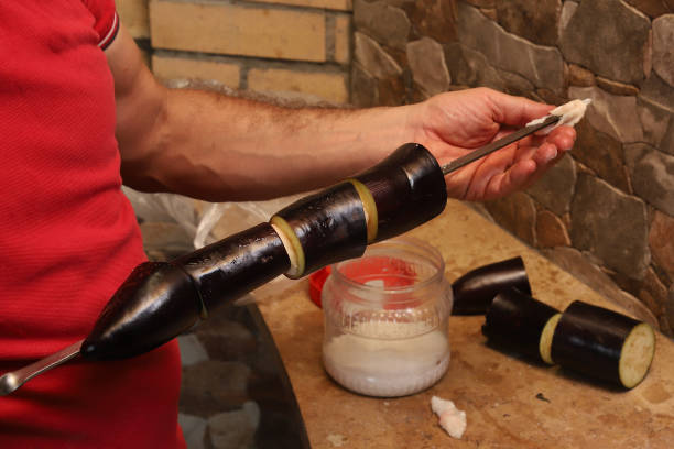 istock chopped eggplant strung on a skewer through a piece of lard 1440363321