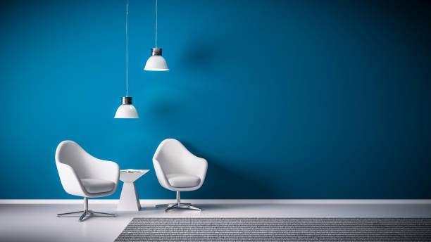 istock white chairs in front of blue wall 1440378243