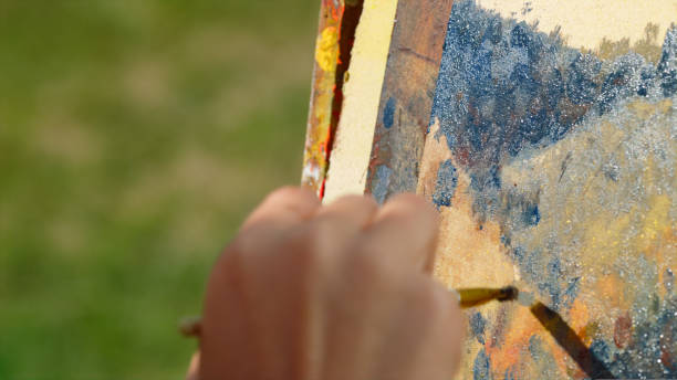 istock Unknown painter drawing nature outdoor. Closeup artist hand creating craft art 1440380599