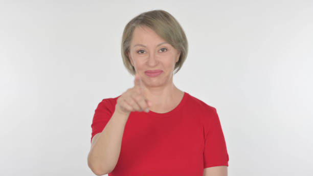 istock Old Woman Pointing at the Camera on White Background 1440383128