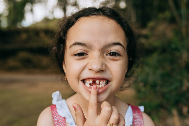 istock Little girl showing missing baby tooth 1440396701