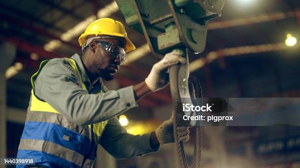 Factory Workers Are Moving Goods In The Factory Stock Photo - Download Image Now - Factory, Safety, Protective Workwear