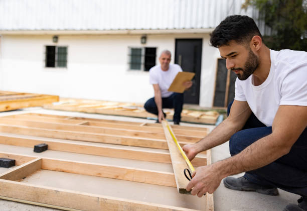 men volunteering to build a house and taking some measurements - instrument of measurement organization housing project housing development imagens e fotografias de stock