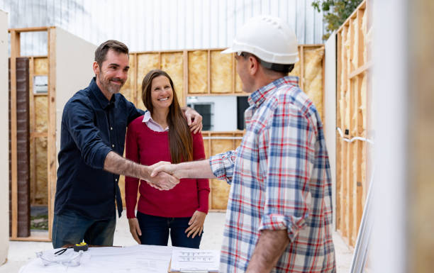 istock Couple greeting the architect building their house with handshake 1440404397