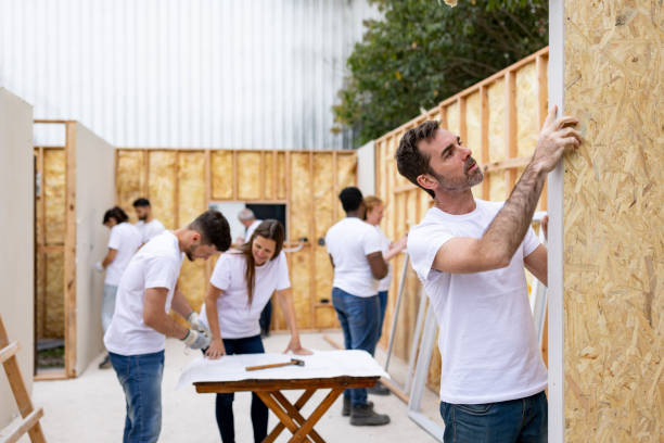 istock Group of volunteers building a house 1440404422