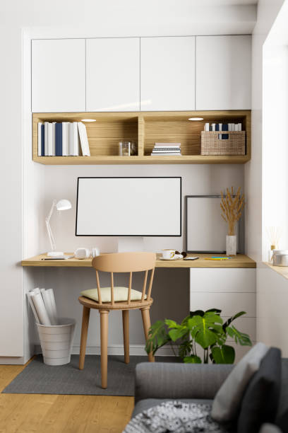 istock Minimal nordic Scandinavian working space interior with computer on wood table, white wall. 1440404820