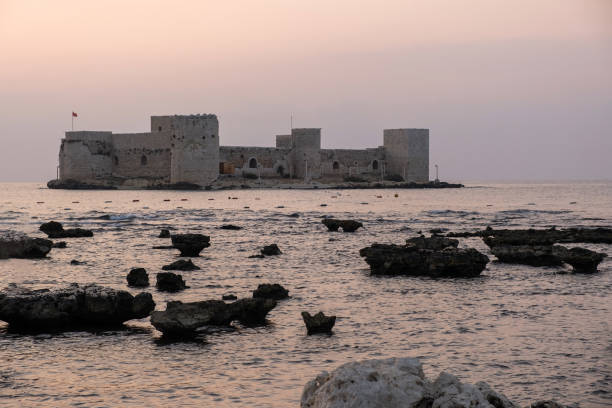 Mersin, Turkey - August 24, 2021: Kizkalesi or Maiden Castle near Mersin on a small island at sunrise