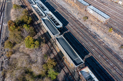 Aerial view of rail cars filled with coal in a train yard