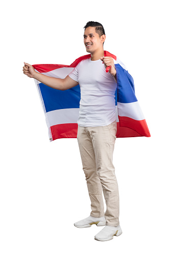 Asian men celebrate Thailand's independence day on 05 December by holding the Thailand flag isolated over white background