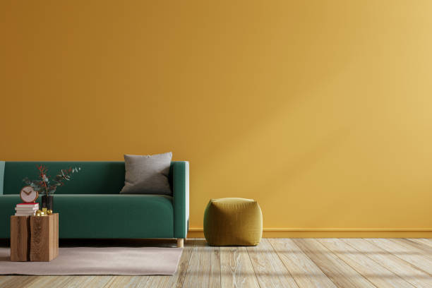 istock Mockup living room interior with green sofa on empty dark yellow color wall background. 1440419574