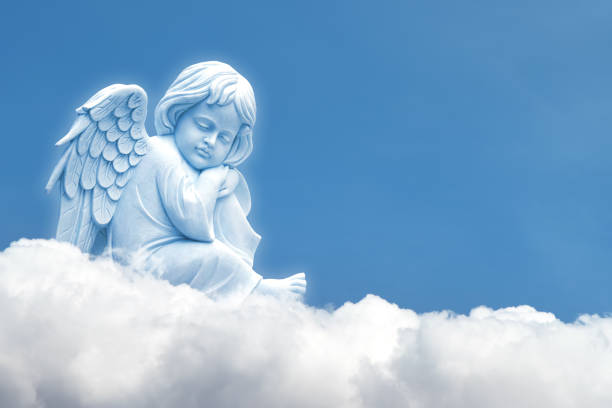 istock Angel on white cloud against blue clear sky 1440419711