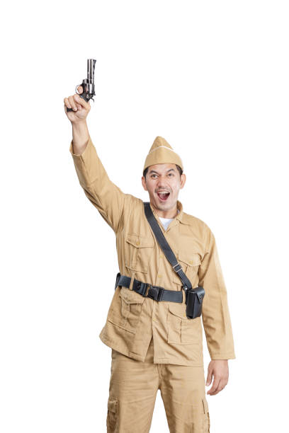 istock Indonesian freedom fighter standing while holding gun 1440420974