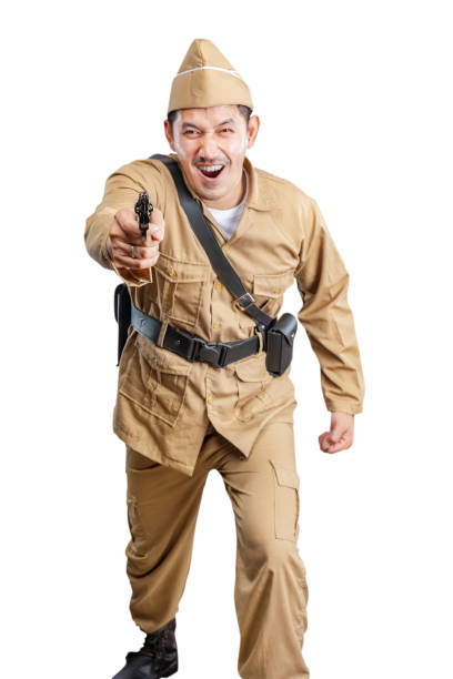 istock Indonesian freedom fighter standing while holding gun 1440420982