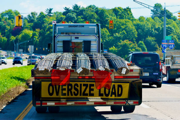 "Oversized Load" Tractor-Trailor with Steel Rebar Bundles stock photo