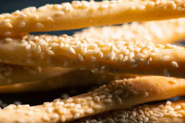 Grissini with Sesame Seeds, also known as breadsticks, grissino, or dipping sticks, are generally pencil-sized sticks of crisp, dry-baked bread originating in Italy.