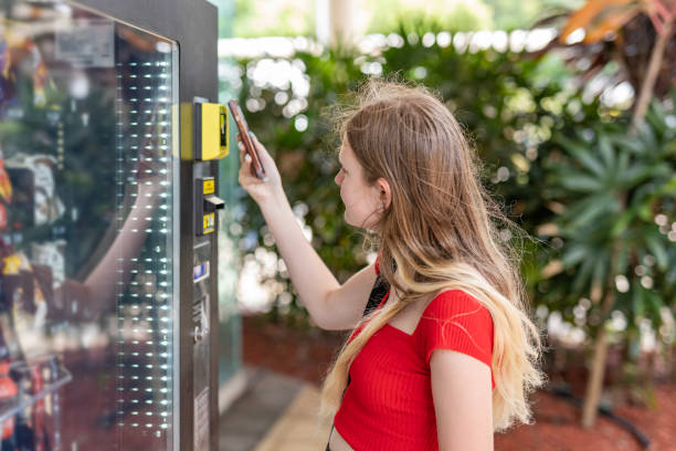 Person making a digital payment at a vending machine