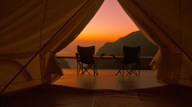 Tourist tent with mountain view on amazing sunrise