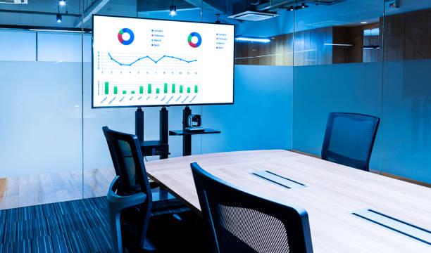 istock Mock up chart slide show presentation on display television in meeting room 1440433021