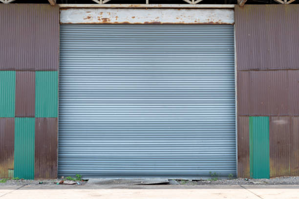 istock Large gray metal shutter door for warehouse 1440434174