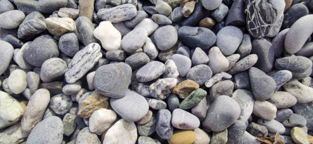 istock Small Sea Stones, Gravel. Background. Textures. Stones on Beach 1440438006