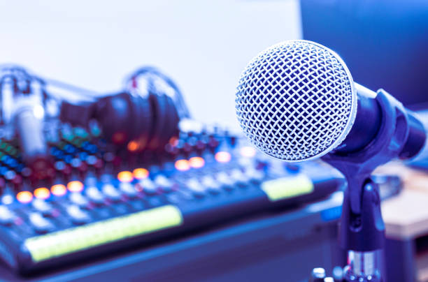 istock Microphone on tripod with mixer background in sound control room. 1440441200