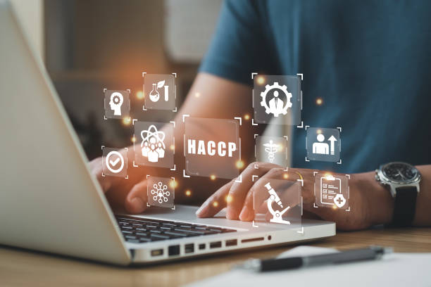 istock Businessman using a computer to HACCP - Hazard Analysis and Critical Control Points, Management system in which food safety. 1440443234
