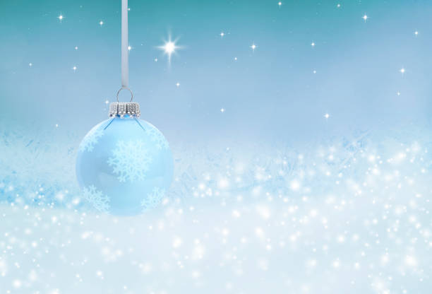 istock Blue glass Christmas ball against blue background 1440443409