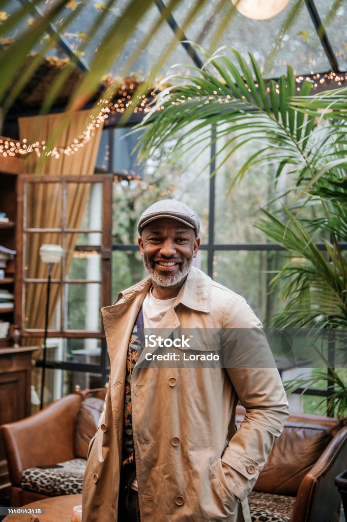 Lifestyle portrait of handsome black man Lifestyle portrait of handsome black man in an atypical cafe Bar - Drink Establishment Stock Photo