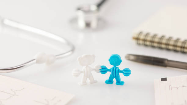 istock Family figure, cardiograms, pen with notepad and stethoscope 1440445151