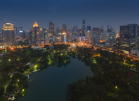 Aerial cityscape view at night of Lumpini Park in Bangkok, Thailand