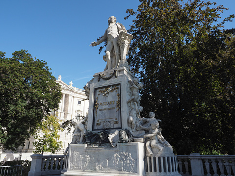 Vienna, Austria - Circa September 2022: Mozart Denkmal translation Mozart monument in Burggarten by architect Karl Koenig and sculptor Viktor Tilgner circa 1896