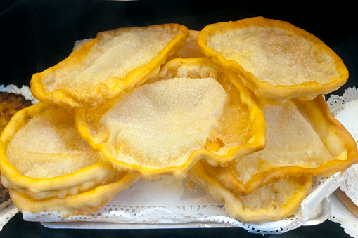 Pig shaped meat pie is on a white plate, close up photo with selective soft focus