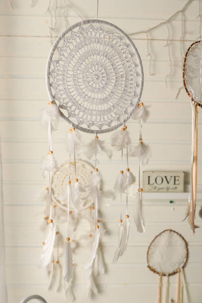 Beautiful dream catcher on the wall with lights. Boho handmade. Style