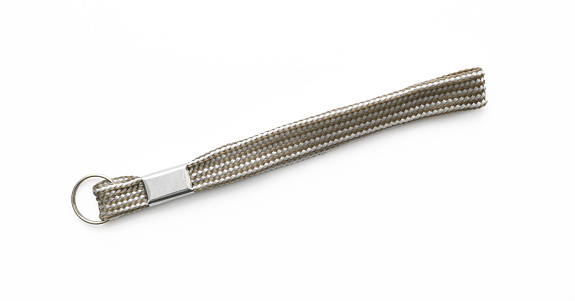 Overhead shot of silver wrist strap, isolated on white with clipping path.