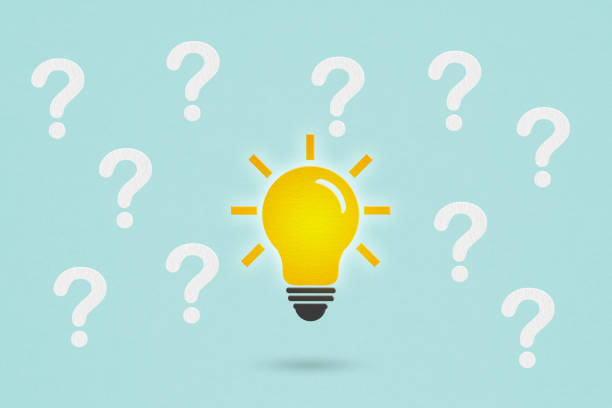 istock bright lightbulb paper cut with many white question marks on grunge blue background  problem solving or idea formation 1440449711