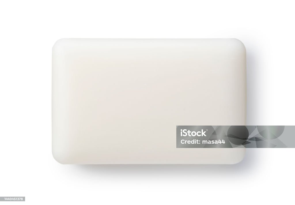Solid soap placed on a white background. White solid soap placed on a white background. Viewed from directly above. Bar Of Soap Stock Photo