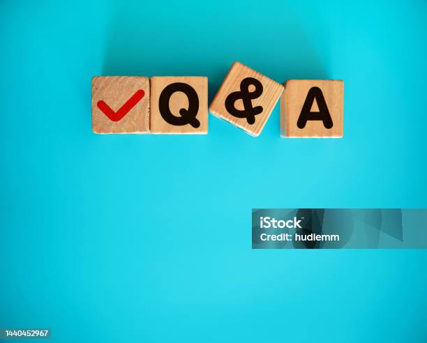 Qa With Toy Block On Blue Background Stock Photo - Download Image Now - Advertisement, Advice, Asking