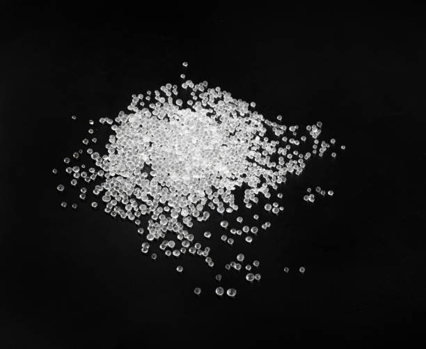 istock Desiccant Silica Gel Adsorbent Crystals on Black Background, Desiccant Polymer Balls 1440452997