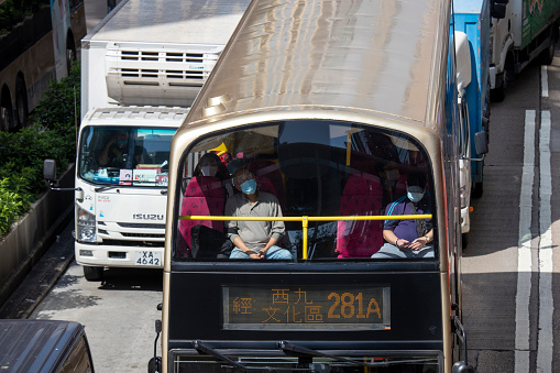 2022 Nov 10,Hong Kong.Citizens wear masks and sit on buses.